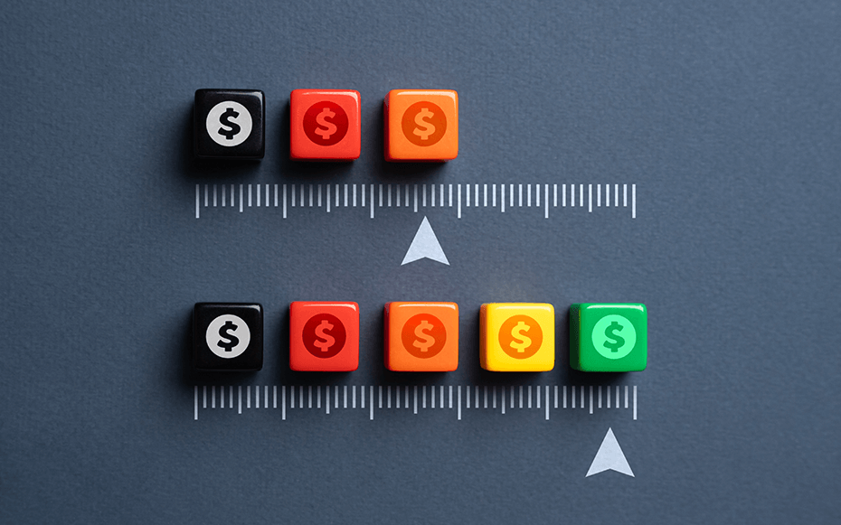 A scale of blocks with dollar signs on them.