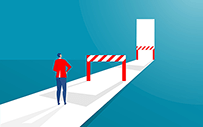 Someone looks are barriers along a pathway to a door.